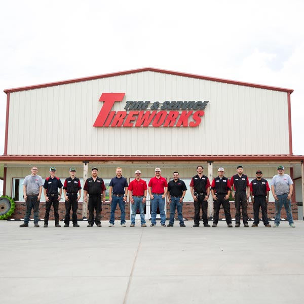Tireworks staff standing in front of building