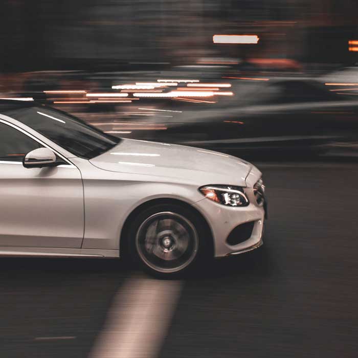 car in motion driving through city